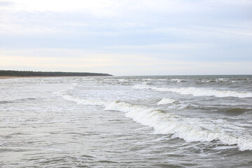Fototapeta na wymiar Baltic sea seascape view of shoreline and small waves.
