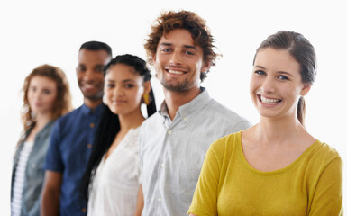 They make a great business team. Cropped shot of a group of work colleagues against a white background.