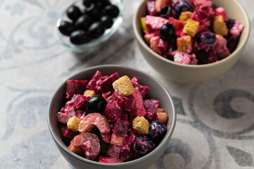vegetable salad, vitamin, with beetroot and celery, with olives, close-up