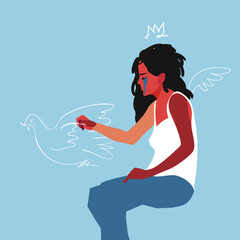 A crying girl draws a peace dove with chalk. The concept of peace and love