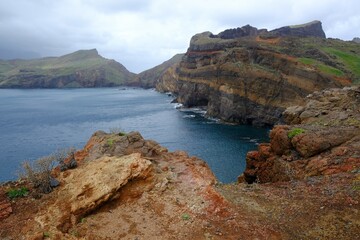 Ponta de Sao Lourenco (Saint Lawrence Peninsula) is the easternmost point on the Madeira map. A miracle of nature. Amazing colorful rocks. Silhouettes of people on trail. Madeira, Portugal