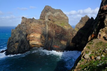 Ponta de Sao Lourenco (Saint Lawrence Peninsula) is the easternmost point on the Madeira map. A miracle of nature. Amazing colorful rocks. Silhouettes of people on trail. Madeira, Portugal