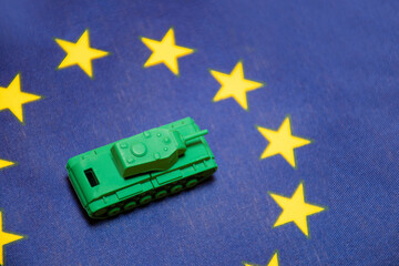 Ivanovo, Russia - 03.03.2022: miniature of real tank on flag of  European Union: no war, danger of...