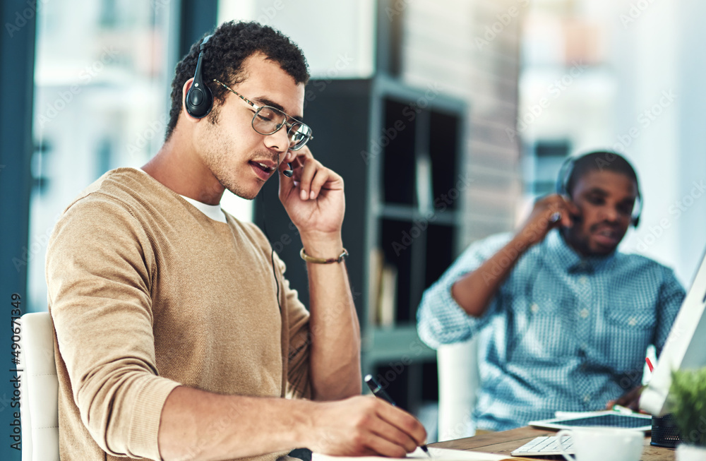 Poster i have the solution to your problem. cropped shot of a call center agent sitting at his desk with hi