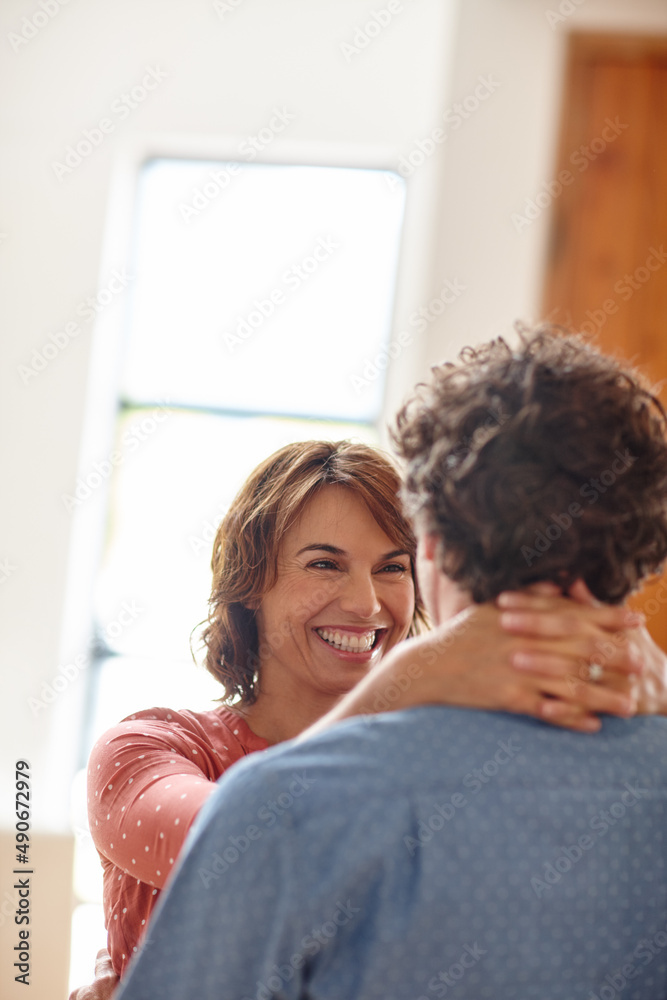 Poster You give me that home feeling. Shot of a husband and wife sharing an affectionate moment at home.