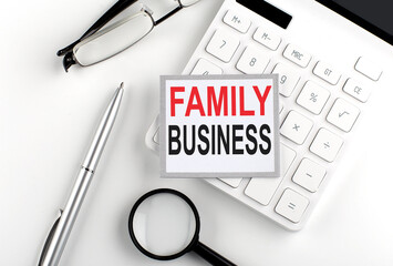 FAMILY BUSINESS text on the sticker with calculator, glasses and magnifier