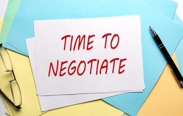 TIME TO NEGOTIATE text on paper on the colorful paper background
