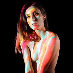 Projection from beamer or projector on young woman looks like body painting	