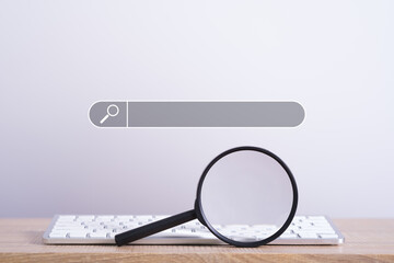 magnifying glass with computer keyboard to Searching for information. Using Search Console with your website. Data Search Technology Search Engine Optimization. Online business search a job for work.