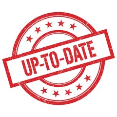UP-TO-DATE text written on red vintage round stamp.