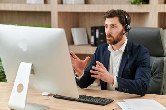 Representive practitioner leads online training wearing a suit and headset, with positive vibes and active gestures and explanations
