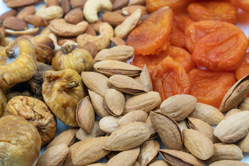 Dried fruits with nuts. Cashew, hazelnuts, peanuts, dried apricots, viburnum, raisins.