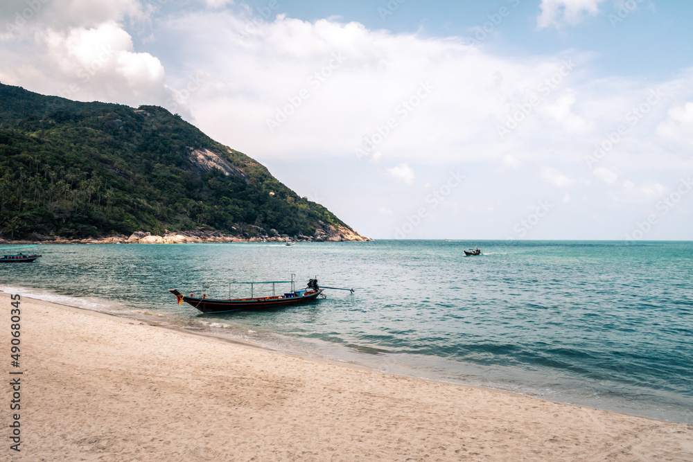 Wall mural thai traditional wooden boat and beautiful sand beach. koh phangan, thailand.