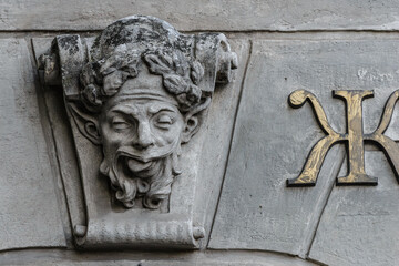 Elements of architectural decorations of buildings, sculptures and statues, public places in Lviv, Ukraine. The mascaron.