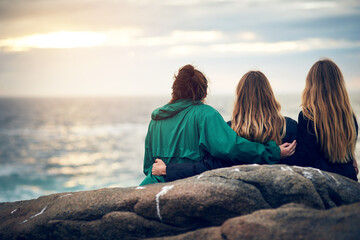 Fototapeta premium There is nobody better to look at this view together. Shot of unrecognizable female friends looking at the view together outdoors.