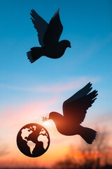 Silhouette of Dove carrying olive leaf branch .Freedom concept and international day of peace