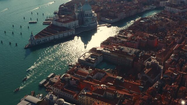 Cinematic dolly back reveal drone shot over St Marco Square and Venice Basilica