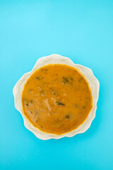 vegetable soup with spinach in beautiful bowl and spoon