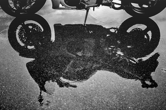 Motorcycle reflection in water
