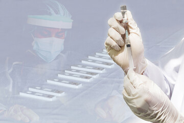 Doctor's hand holding a syringe, Concept fight against virus covid-19 coronavirus