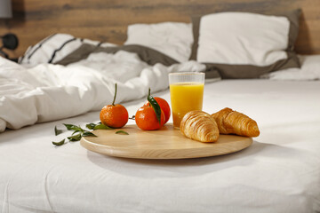 Bedroom interior and breakfast on bed 