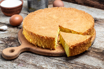 Homemade sponge cake on wooden table, Bakery background. Culinary, cooking, bakery concept. place for text, top view