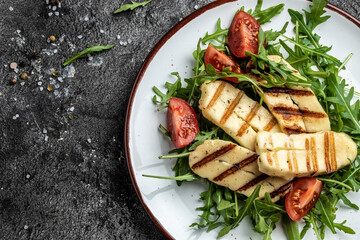 vegeterian salad with fried halloumi and tomatoes, closeup, keto ketogenic diet. Delicious breakfast or snack, Clean eating, dieting, vegan food concept. top view - obrazy, fototapety, plakaty