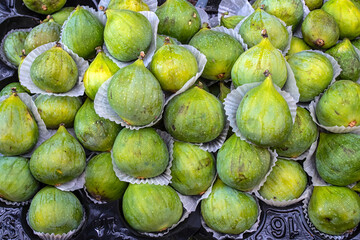 Fresh ripe green figs (Ficus carica) on a market stall