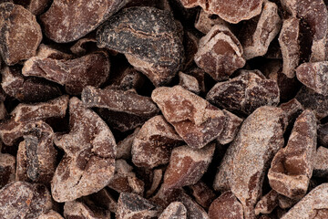 Pieces of broken cocoa beans - also called chocolate nibs, detail under microscope image width 23mm