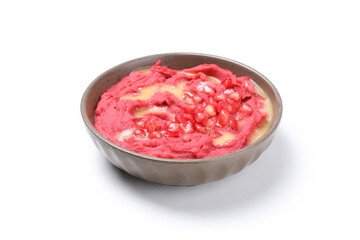 Bowl of beet hummus isolated on white background