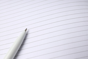 Blank notebook with pen on whole background