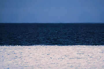 Winter seashore in the colours of the Estonian flag