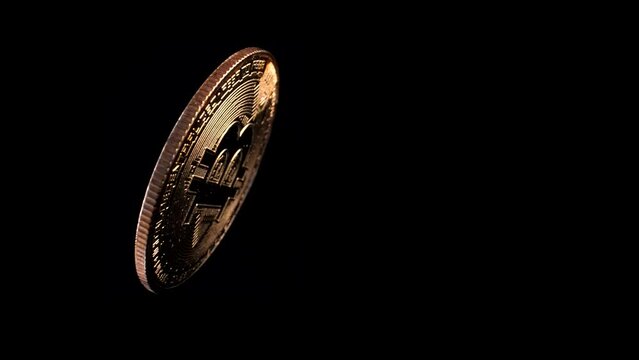 Gold Bitcoin BTC Coin Heads White Light Black Background 4K 60 FPS Slow Motion Overhead Dolly Out Crypto Currency Spin