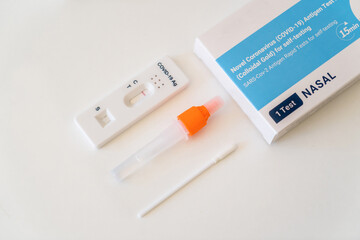 Covid-19 rapid antigen test kit with casette, test tube and nasal swab. Negative result. Self testing