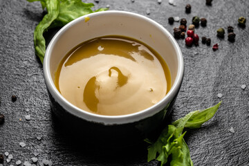 Fresh homemade organic mustard and honey sauce on a dark background, Food recipe background. Close up