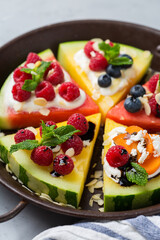 Watermelon pizza with berries, fruit, yogurt, feta cheese