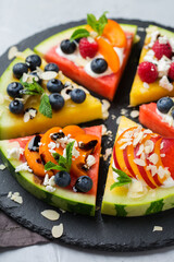 Watermelon pizza with berries, fruit, yogurt, feta cheese