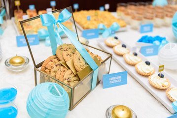 Candy bar with caramel cookies in the glass box at the wedding party