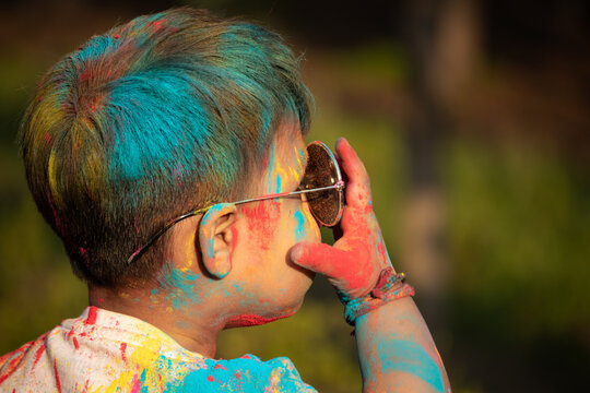 Indian Festive Theme - Happy Asian Kid Baby Boy Having Fun With Non Toxic Herbal Holi Color Powder Called Gulal Or Abir Rang Abeer During Hindu Ritual Dol Purnima. Holiday Outdoor Fun Activity