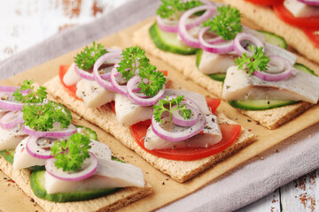 Sandwiches with herring and vegetables	