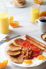 Traditional British breakfast with sausages and beans	
