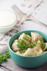 Russian national dish pelmeni served in a plate