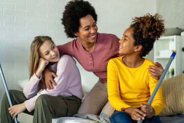 Happy multiethnic children helping for mother do household and domestic chores together
