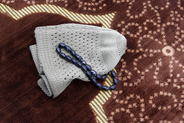 skull-cap usually worn by Muslim men, its a symbol of muslim Sunnah