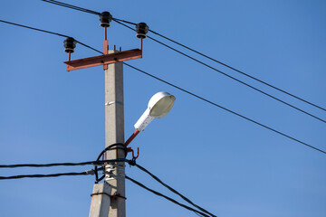 Street lantern against blue sky. City lamp