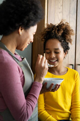 Happy mother and children in the kitchen. Healthy food, family, cooking concept