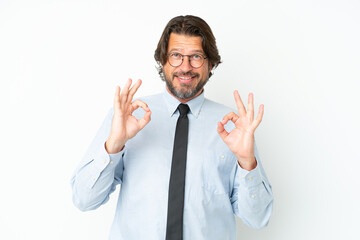 Senior dutch business man isolated on white background showing an ok sign with fingers
