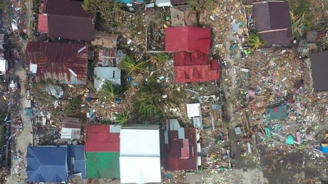 Damaged Houses, Pile Of Debris And Trash Left After The Powerful Typhoon Odette In Southern Leyte, Philippines. - aerial ascend