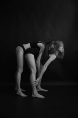 Fototapeta na wymiar two girls dance and touch each other's bodies, photos on film, soft focus and strong grain and noise