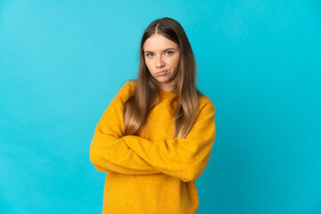 Fototapeta premium Young Lithuanian woman isolated on blue background feeling upset